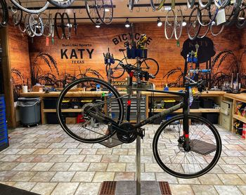 Bicycle parked against wall in city