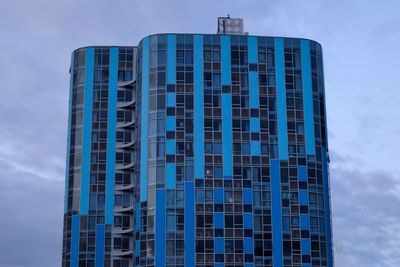 Low angle view of modern building against sky