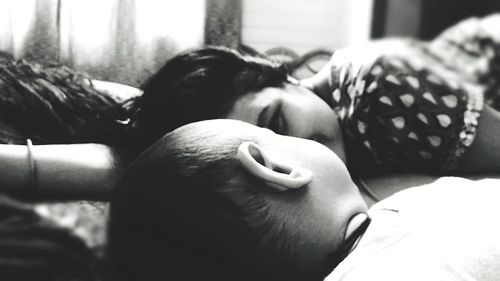 Close-up of sleeping on bed