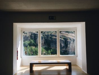 Table on floor by window of house