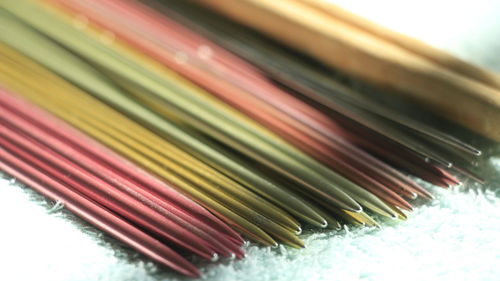 Close-up of knitting needles on fabric