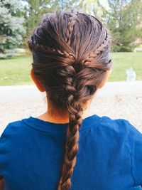 Rear view of girl  with braids outdoors
