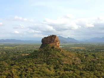 Rock formations on landscape against sky