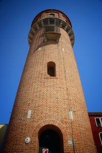 Low angle view of tower against clear blue sky