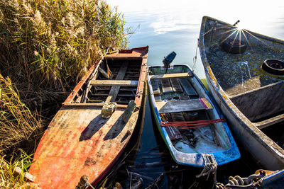 Boats abandoned to the elements on the po river delta in rovigo italy