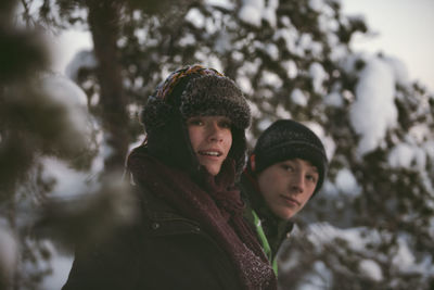 Two teenage boys in winter scenery