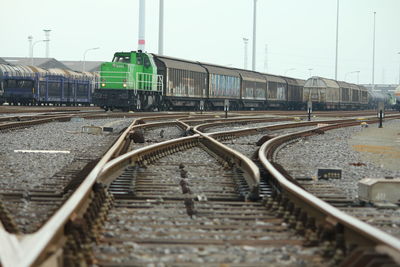 Train on railroad track against sky