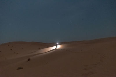 Low angle view of sand dune