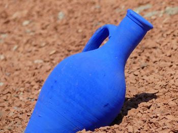 High angle view of blue toy on sand