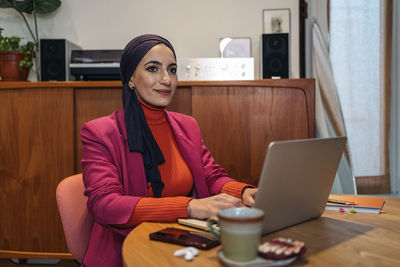 Muslim woman working from home