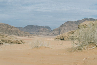 Scenic view of landscape and mountains against sky
