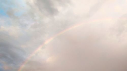 Low angle view of rainbow against sky