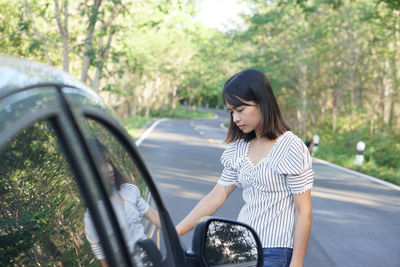 Young woman in car