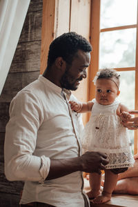 Full length of father with daughter