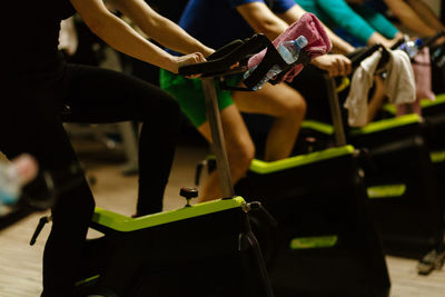 People using exercise bikes at gym