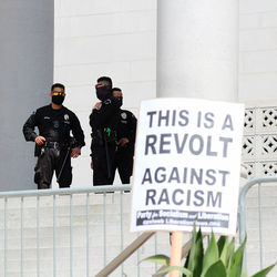 People standing against wall