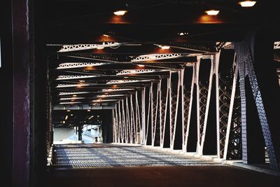 Man walking in illuminated corridor