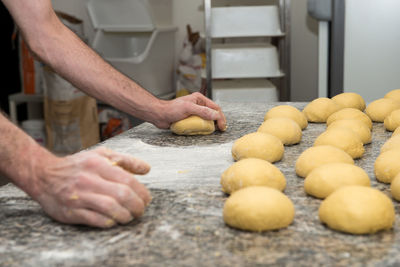 Midsection of man preparing food in kitchen