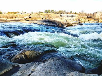 Scenic view of river against clear sky