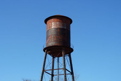 Low angle view of water tower against clear sky