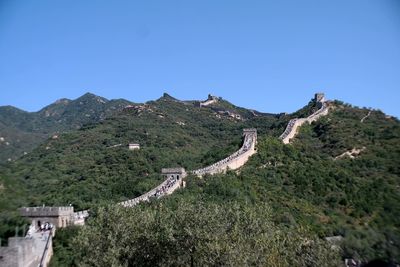 Scenic view of mountains against clear blue sky