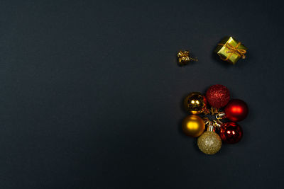 High angle view of fruits on table against black background