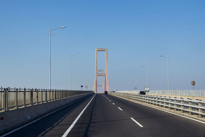 View of bridge over road against clear sky