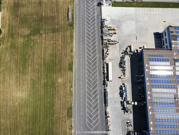 Drone view of warehouses and empty parking lot