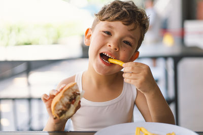 Close-up of boy eating food