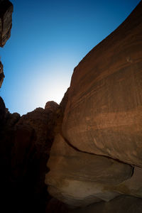 Low angle view of rock formations against sky