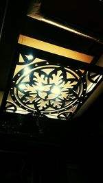 Low angle view of illuminated ceiling