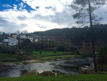 Scenic view of landscape against cloudy sky