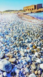 Surface level of rocks against blue sky