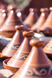 Full frame of antique brown containers for sale at market