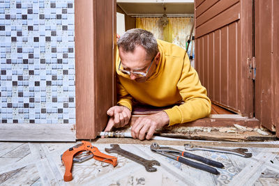 Portrait of boy playing with toy blocks at home