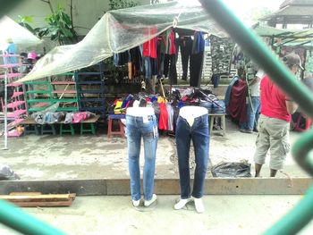 Rear view of people standing in temple