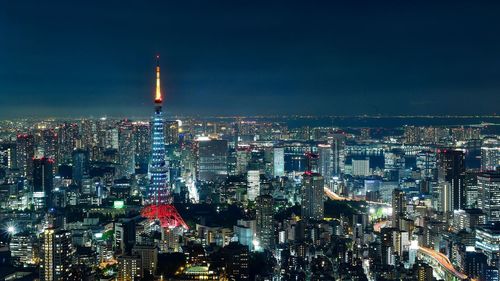 Illuminated buildings in city at night