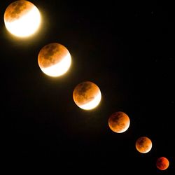 Low angle view of moon against clear sky at night