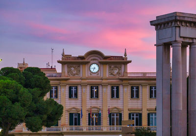 Low angle view of historic building against sky during sunset