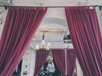 Low angle view of red curtains in restaurant