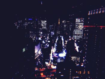 High angle view of illuminated buildings at night