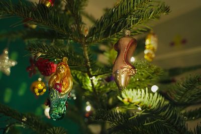 Close-up of christmas ornaments on tree