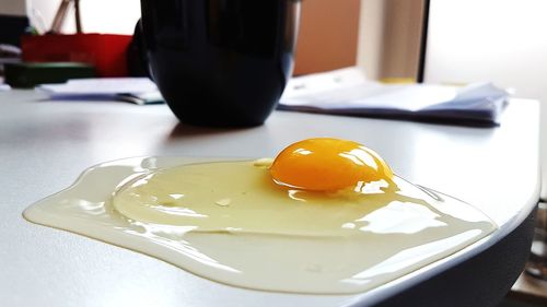 Close-up of egg in plate on table