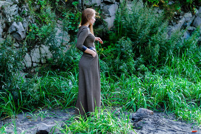 Woman standing in a forest