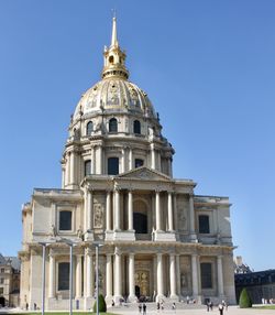 Low angle view of building against blue sky