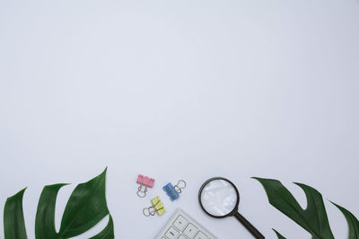 Close-up of clock over white background