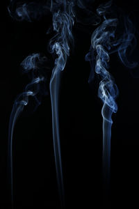 Close-up of smoke against black background