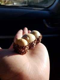 Close-up of hand holding ice cream