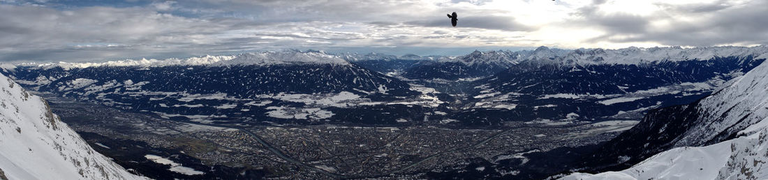 Scenic view of snowcapped mountains against sky
