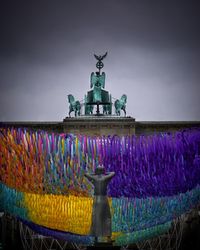 Statue of fountain against sky